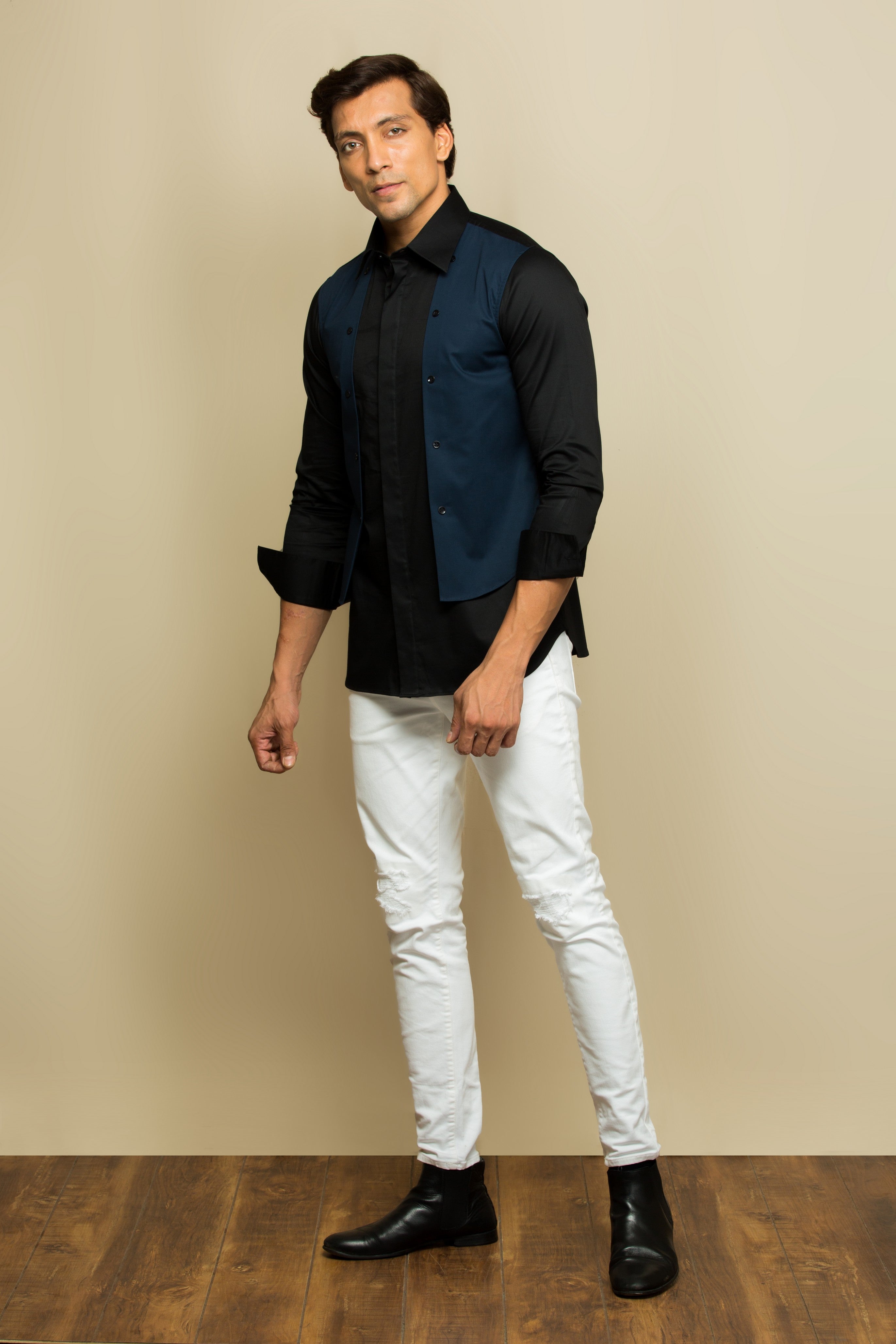 Black shirt with blue chest patch and buttons