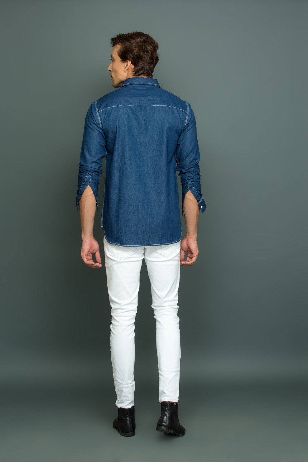 Blue denim with white press button pocket with white stitch detailing