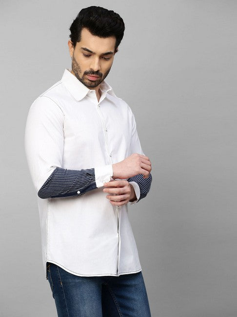 White shirt with dark denim and white stitching patch on sleeves