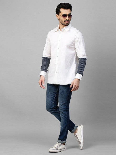 White shirt with dark denim and white stitching patch on sleeves