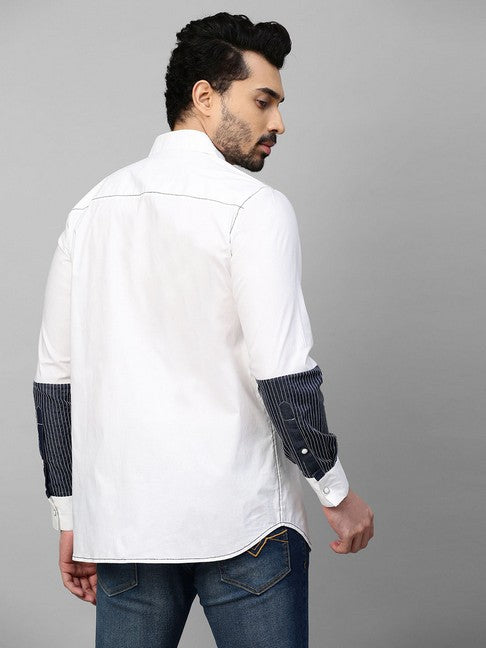 White shirt with dark denim and white stitching patch on sleeves