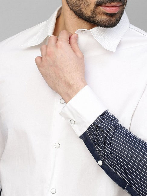 White shirt with dark denim and white stitching patch on sleeves