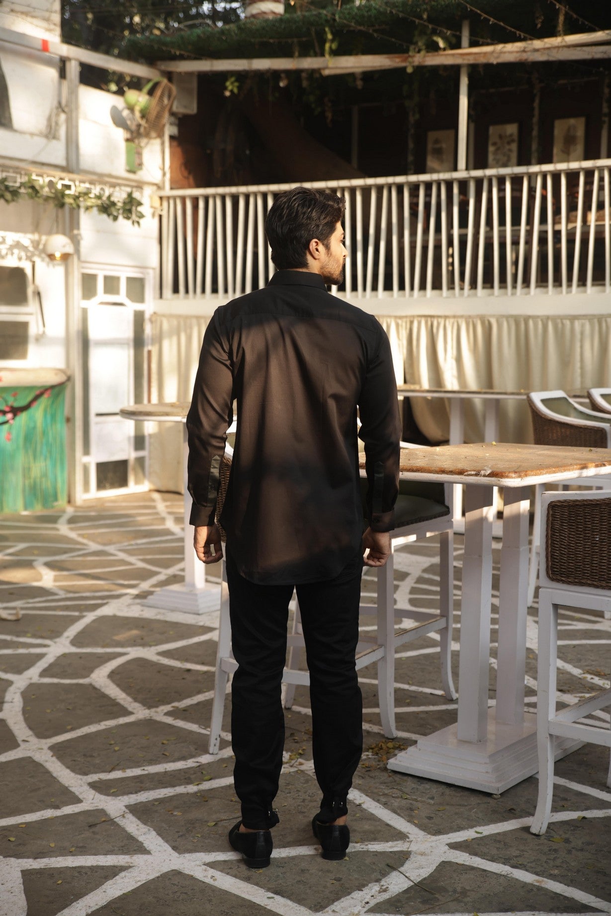 Black shirt with green pleates on the chest and zippered placket