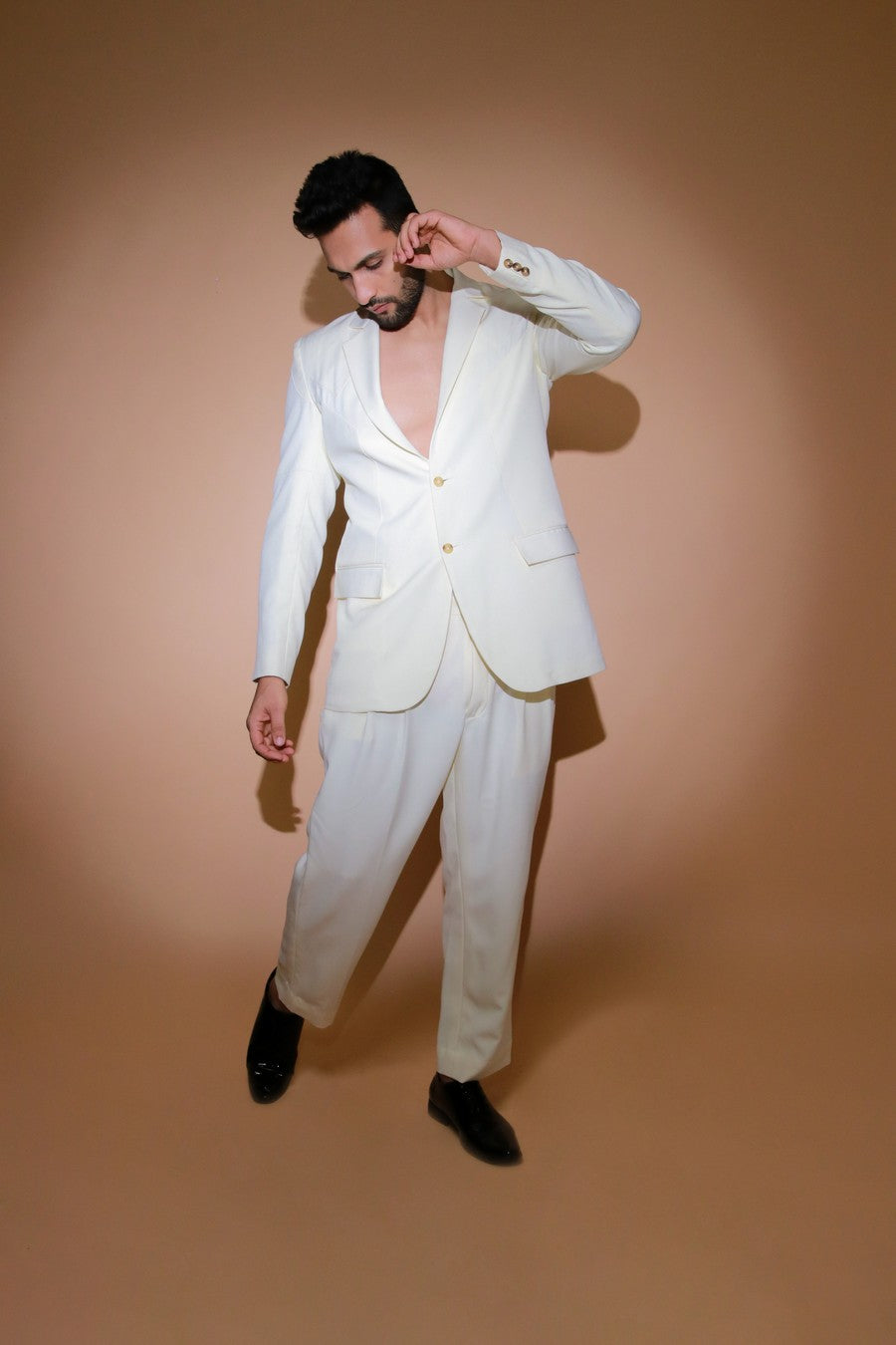 Cream jacket with self stitching panels and straight pleated pants