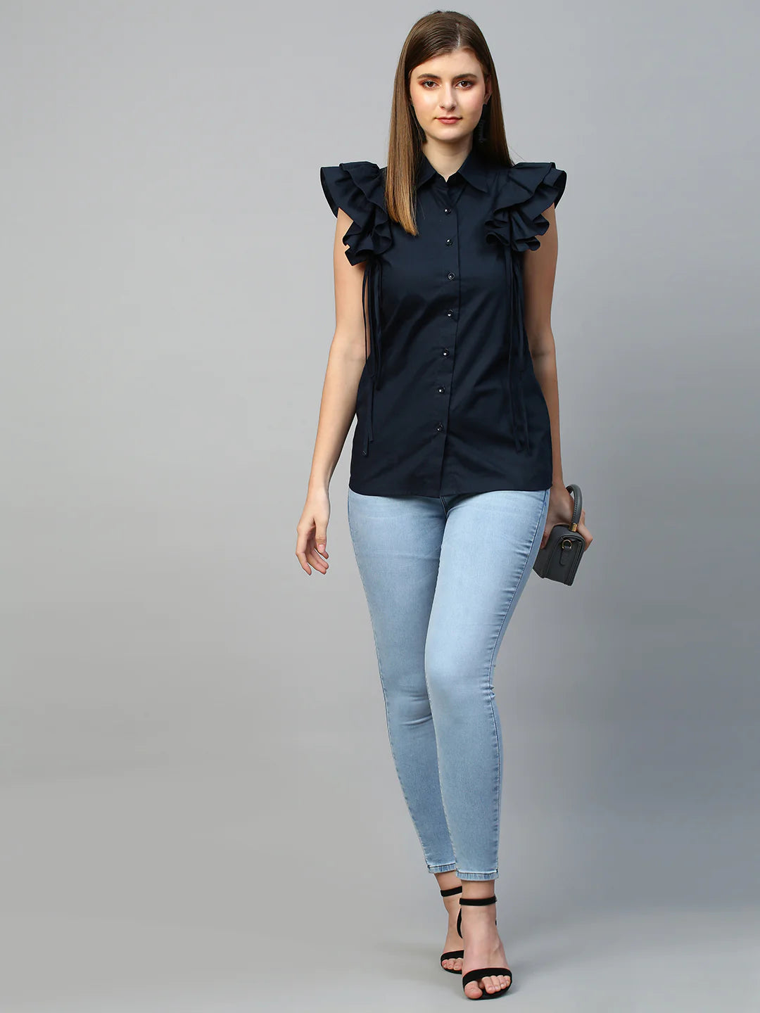 Sleeveless shirt with frills and tie-ups