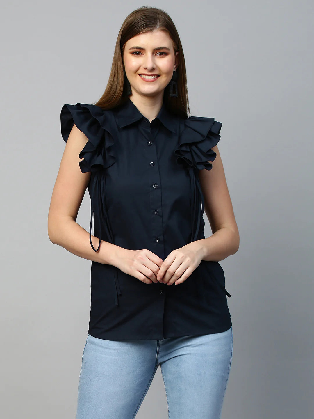 Sleeveless shirt with frills and tie-ups