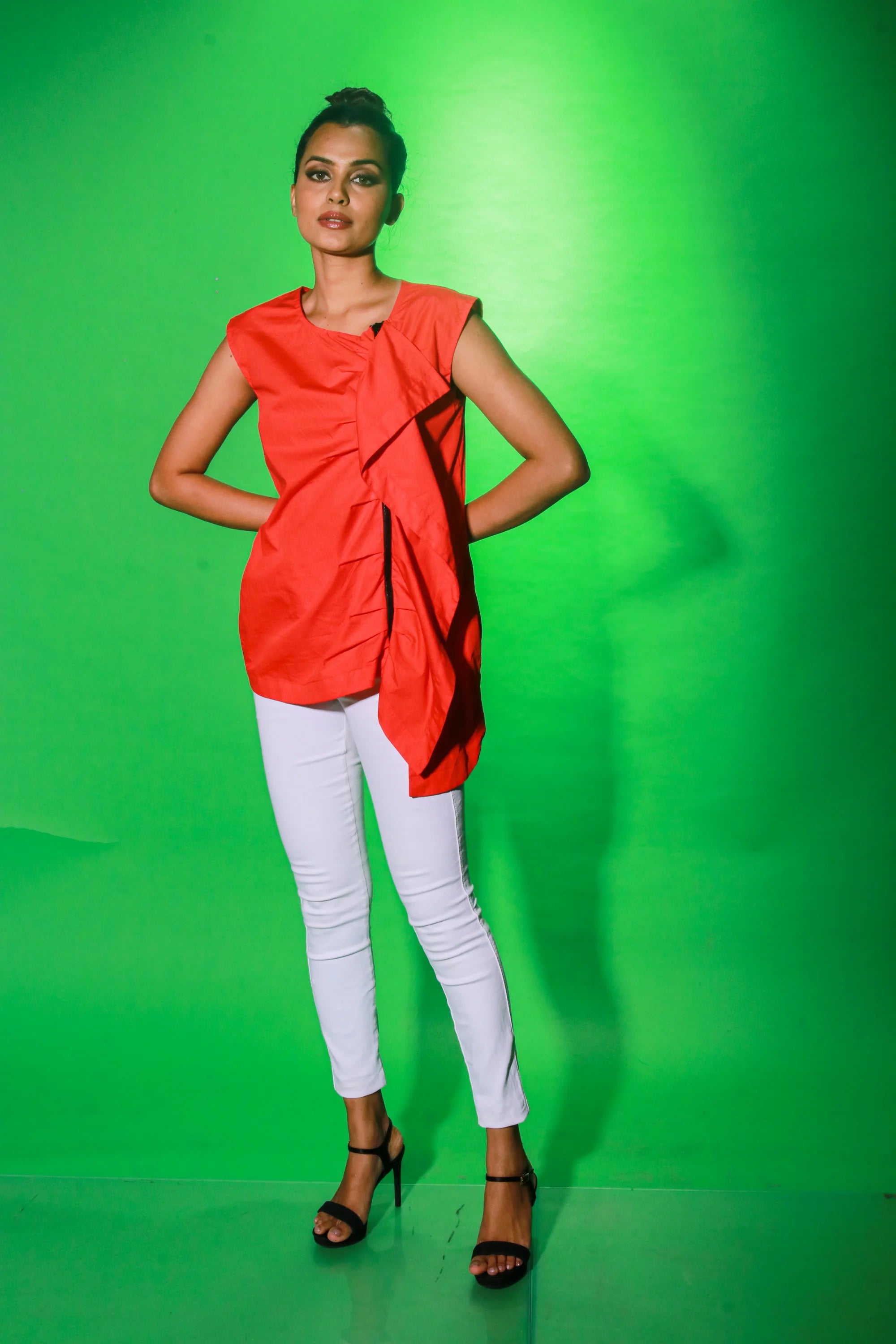 Coral sleeveless top with off center zipper placket and frill