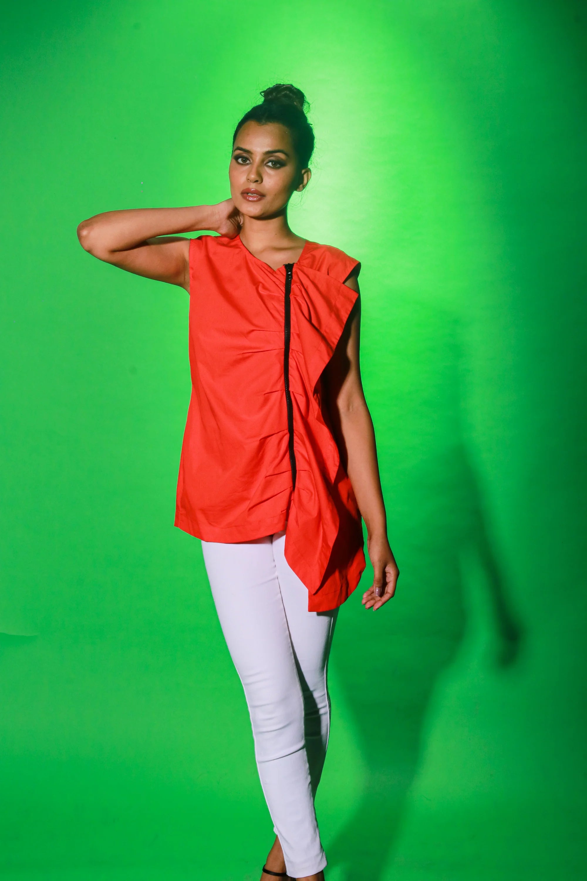 Coral sleeveless top with off center zipper placket and frill