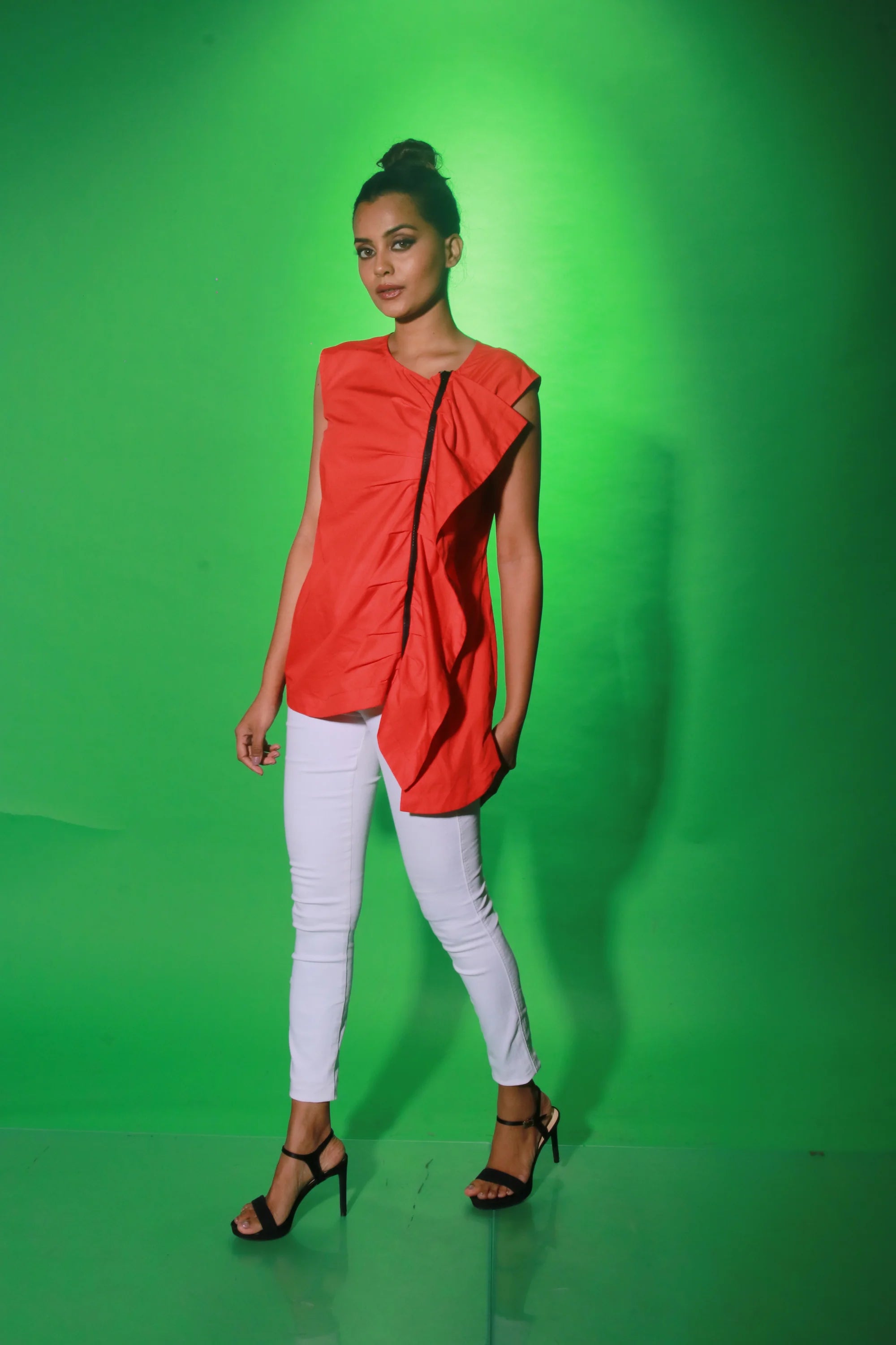 Coral sleeveless top with off center zipper placket and frill