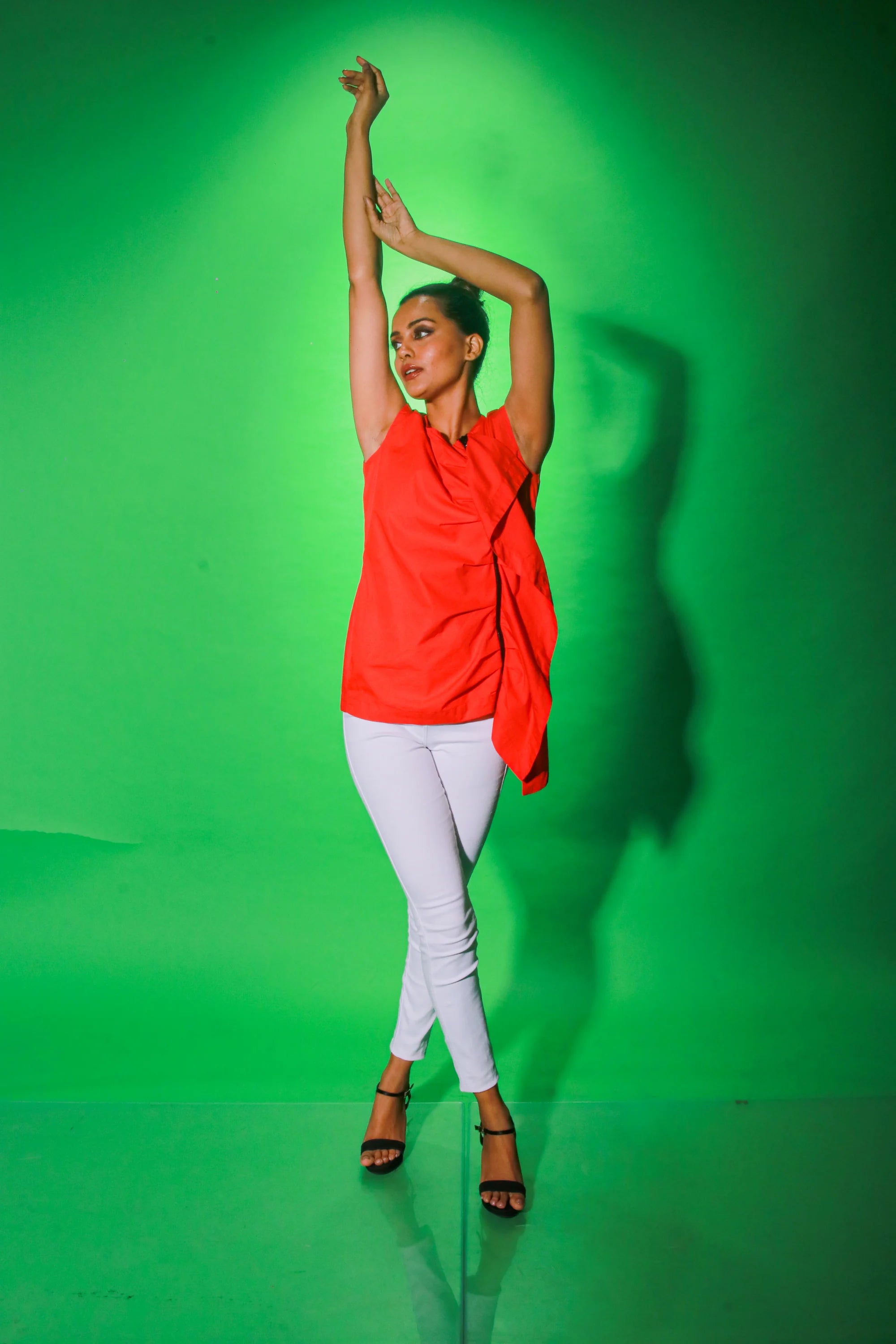 Coral sleeveless top with off center zipper placket and frill