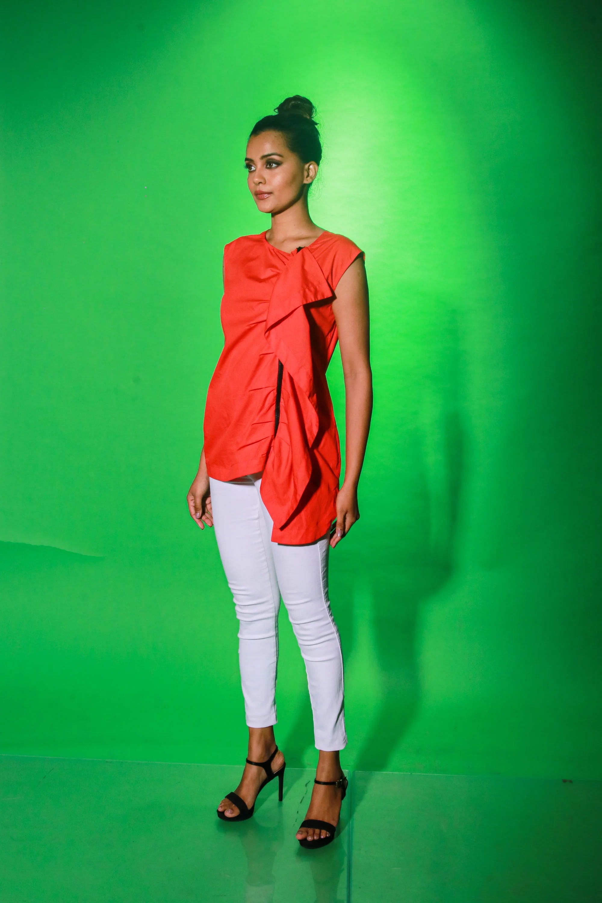 Coral sleeveless top with off center zipper placket and frill