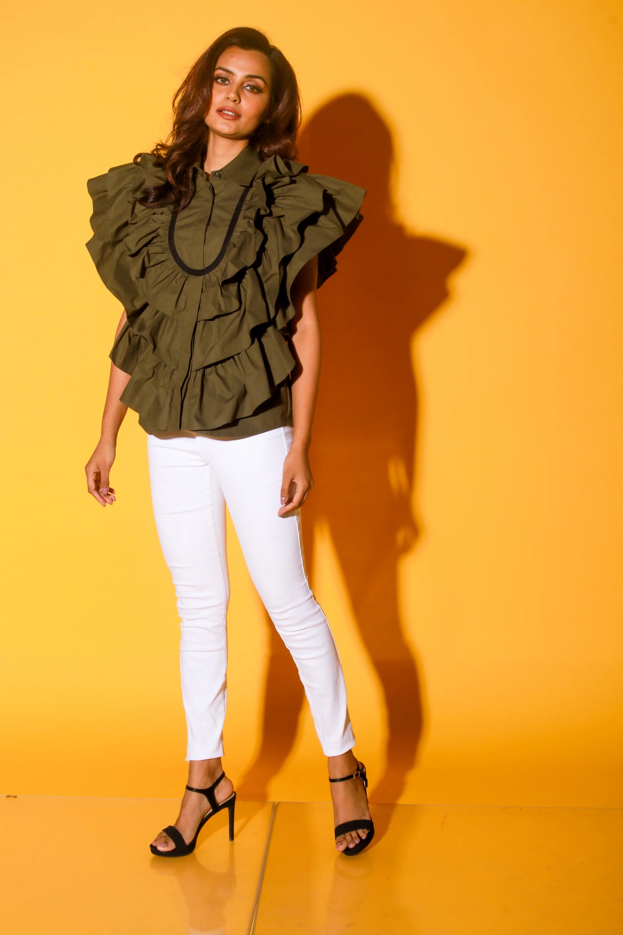 Olive green shirt with ruffles and black pattis on the yoke