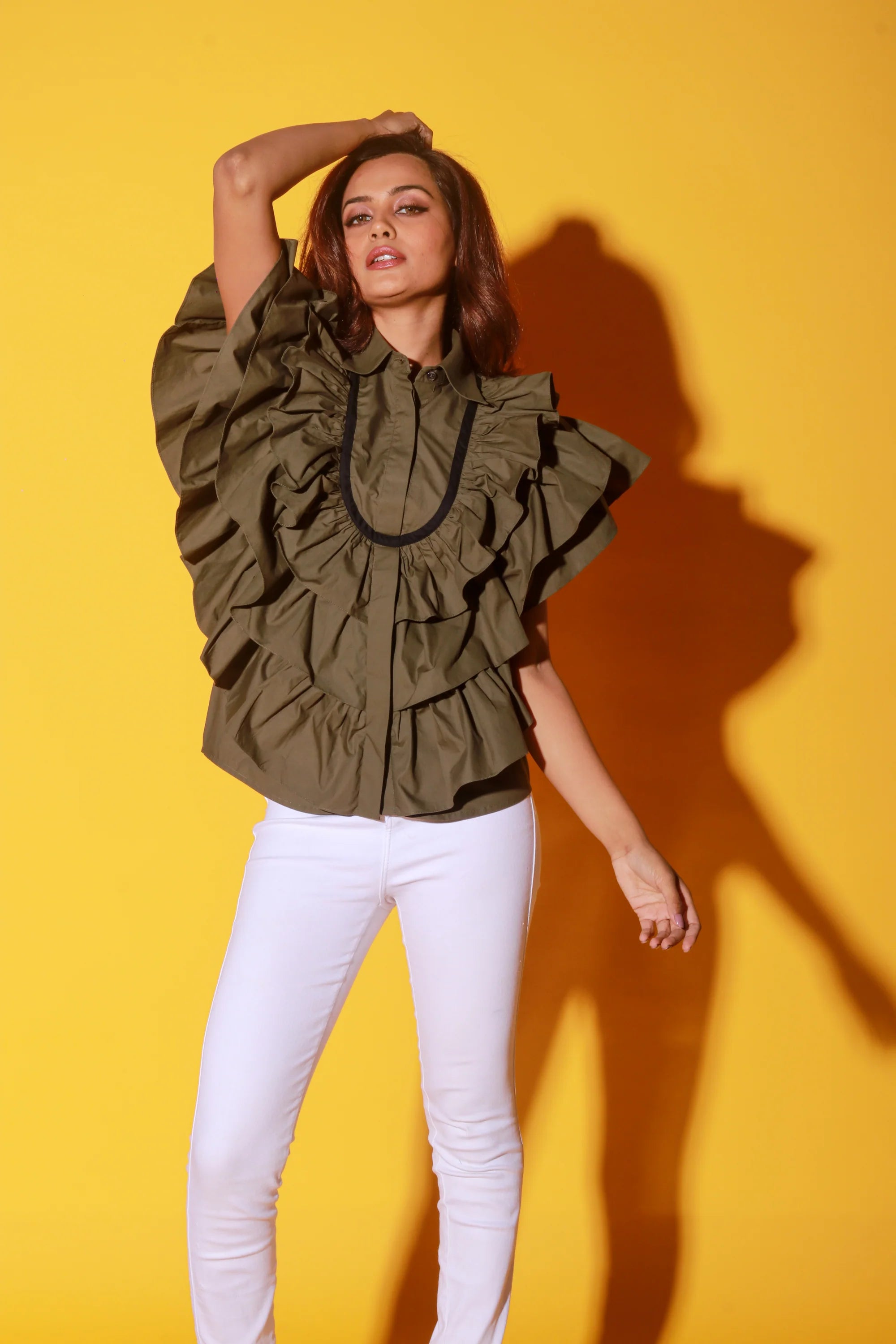 Olive green shirt with ruffles and black pattis on the yoke