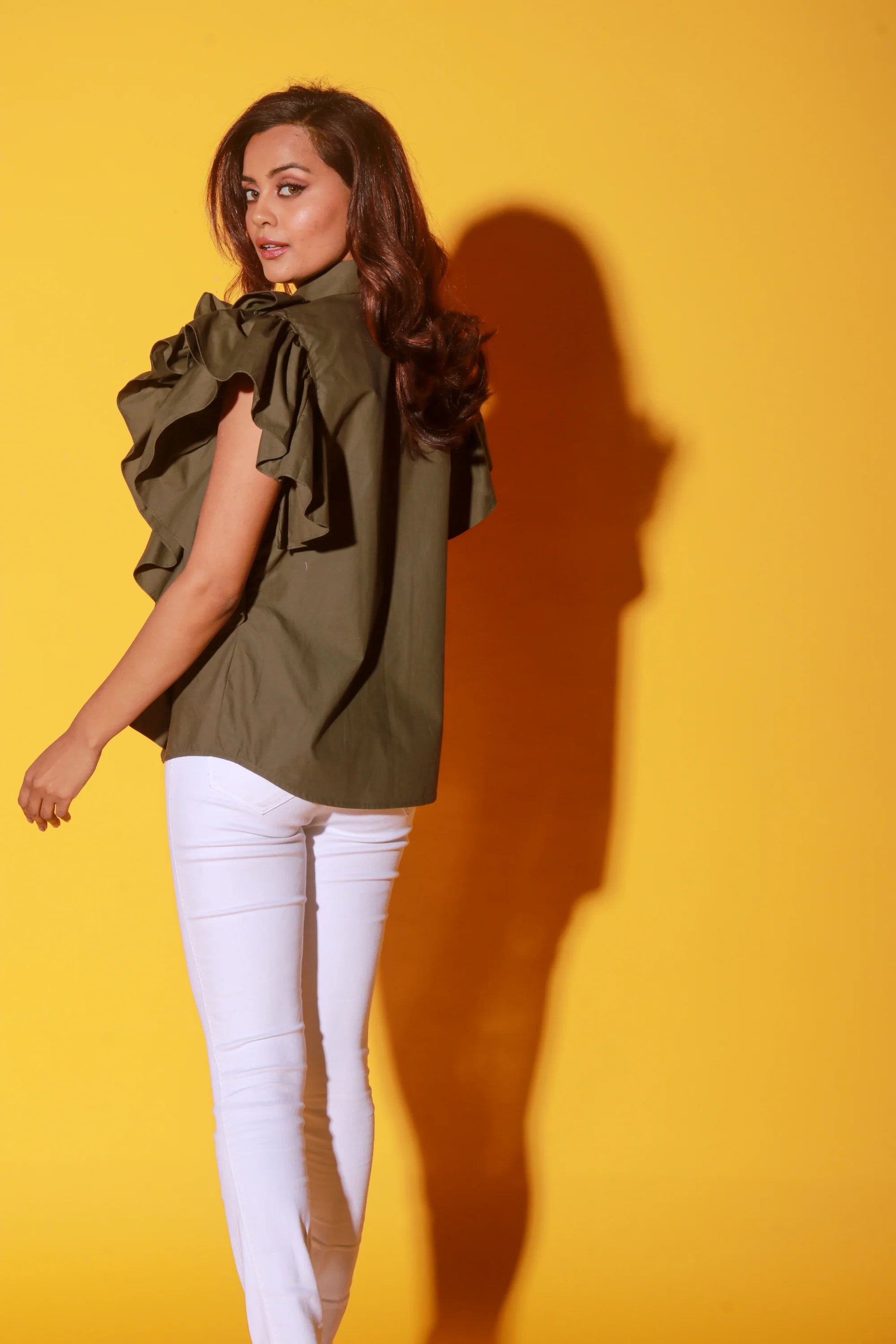 Olive green shirt with ruffles and black pattis on the yoke