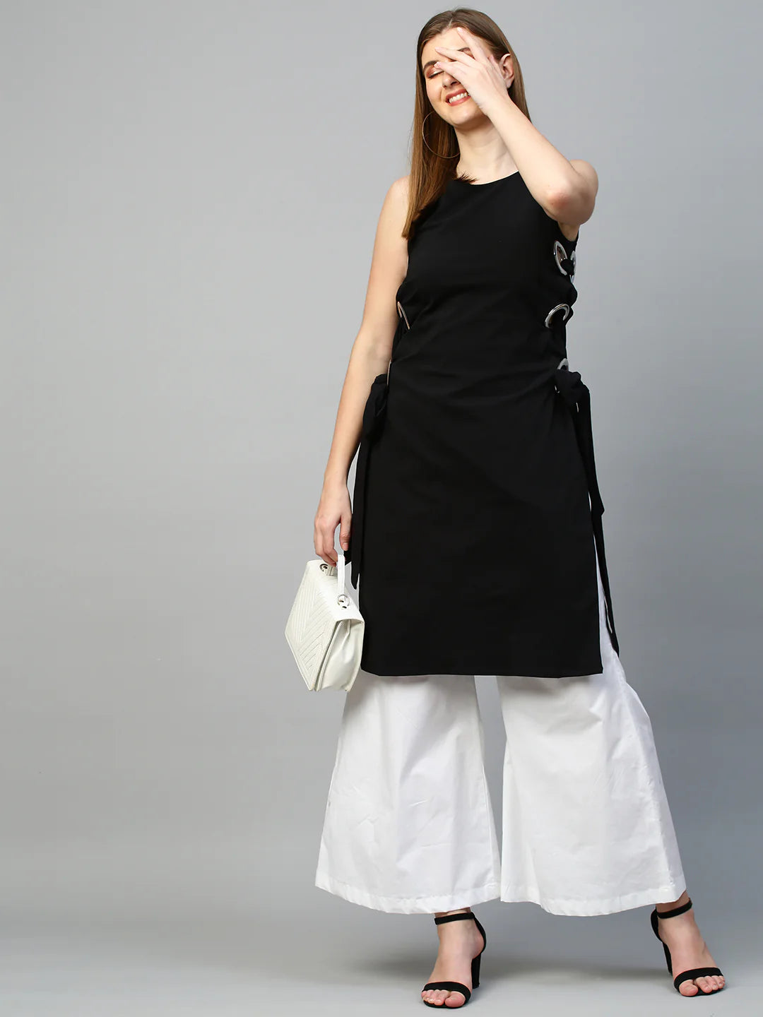 Top with eyelets tie-up feature and flared pants co-ord set
