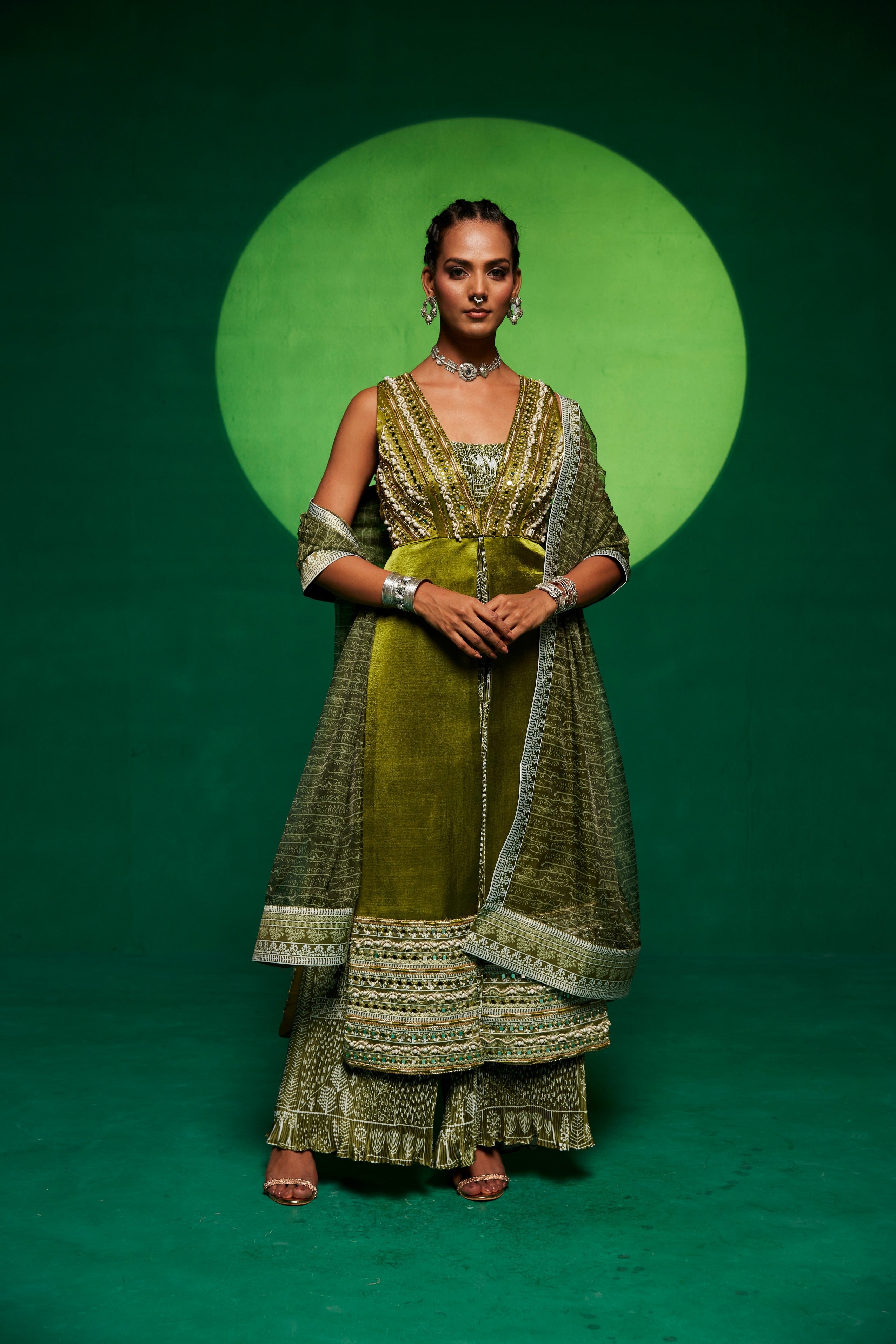 Olive green jumpsuit layered up with a long shrug