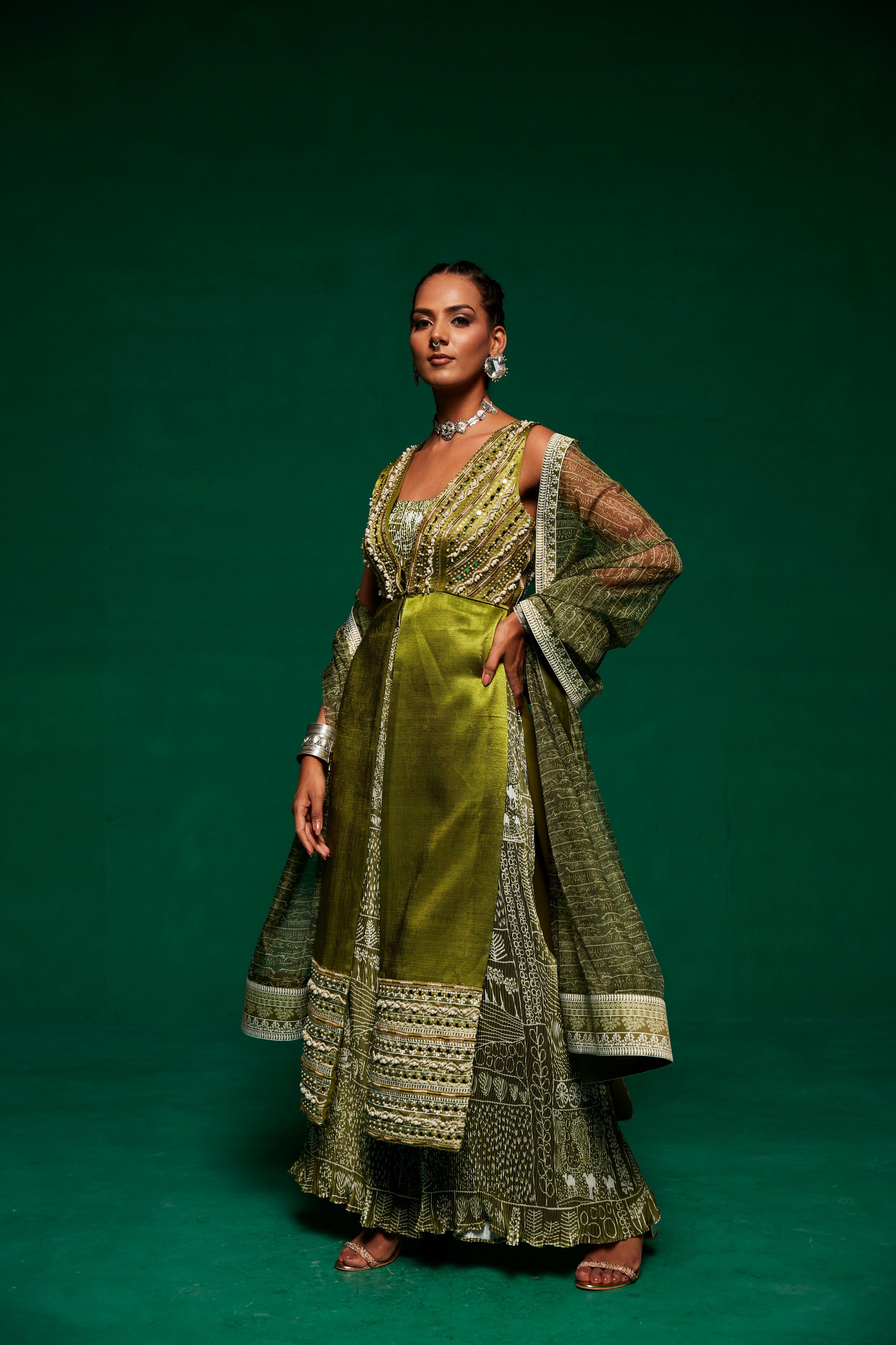 Olive green jumpsuit layered up with a long shrug