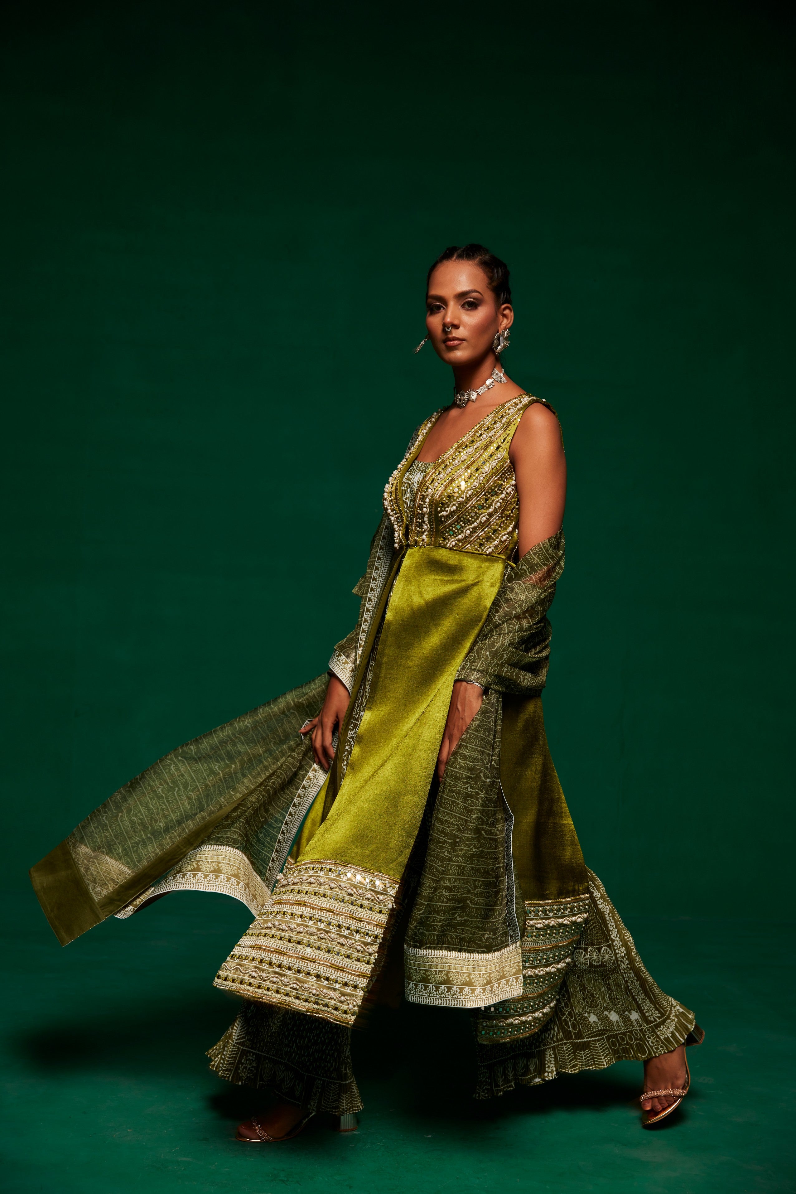 Olive green jumpsuit layered up with a long shrug