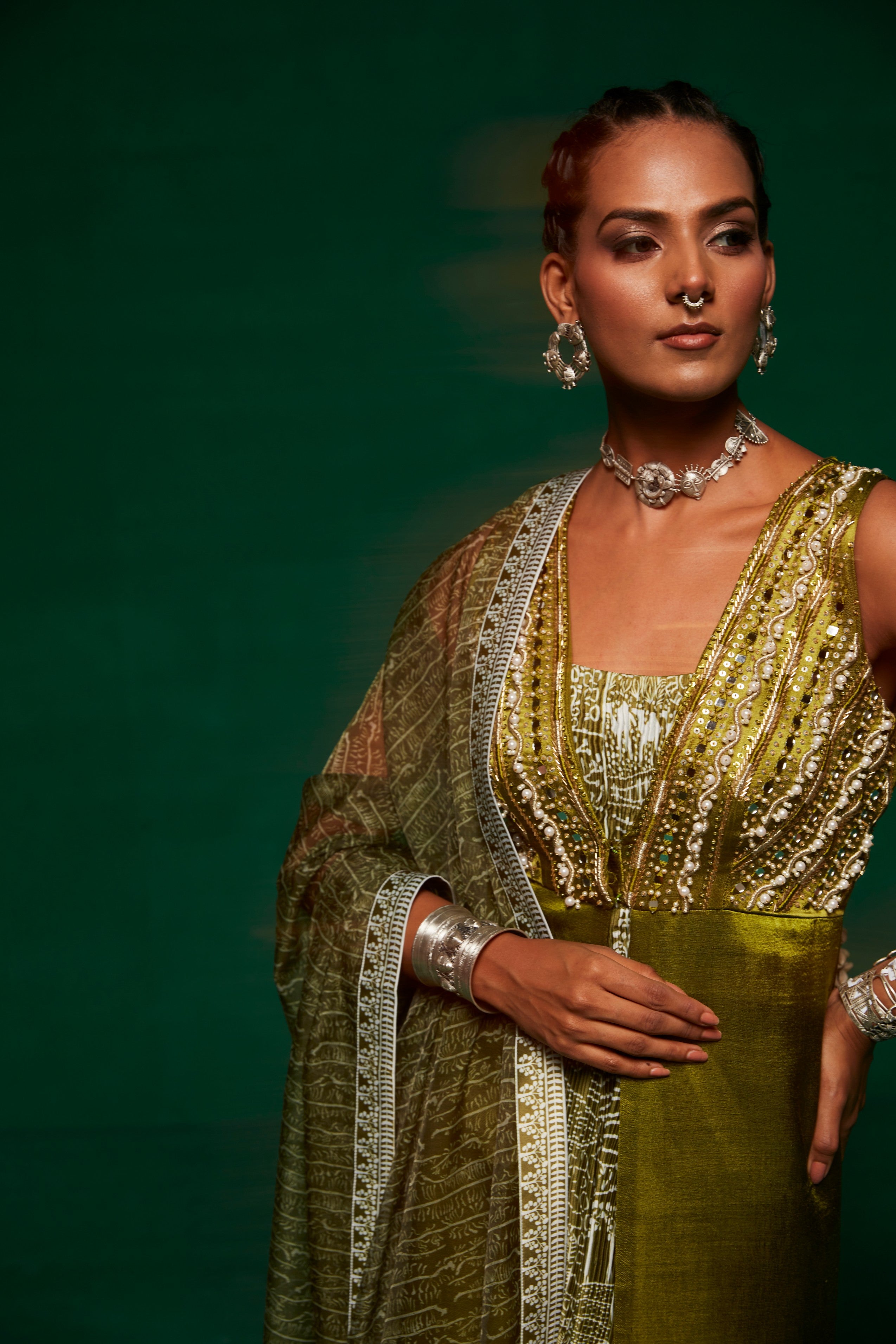 Olive green jumpsuit layered up with a long shrug