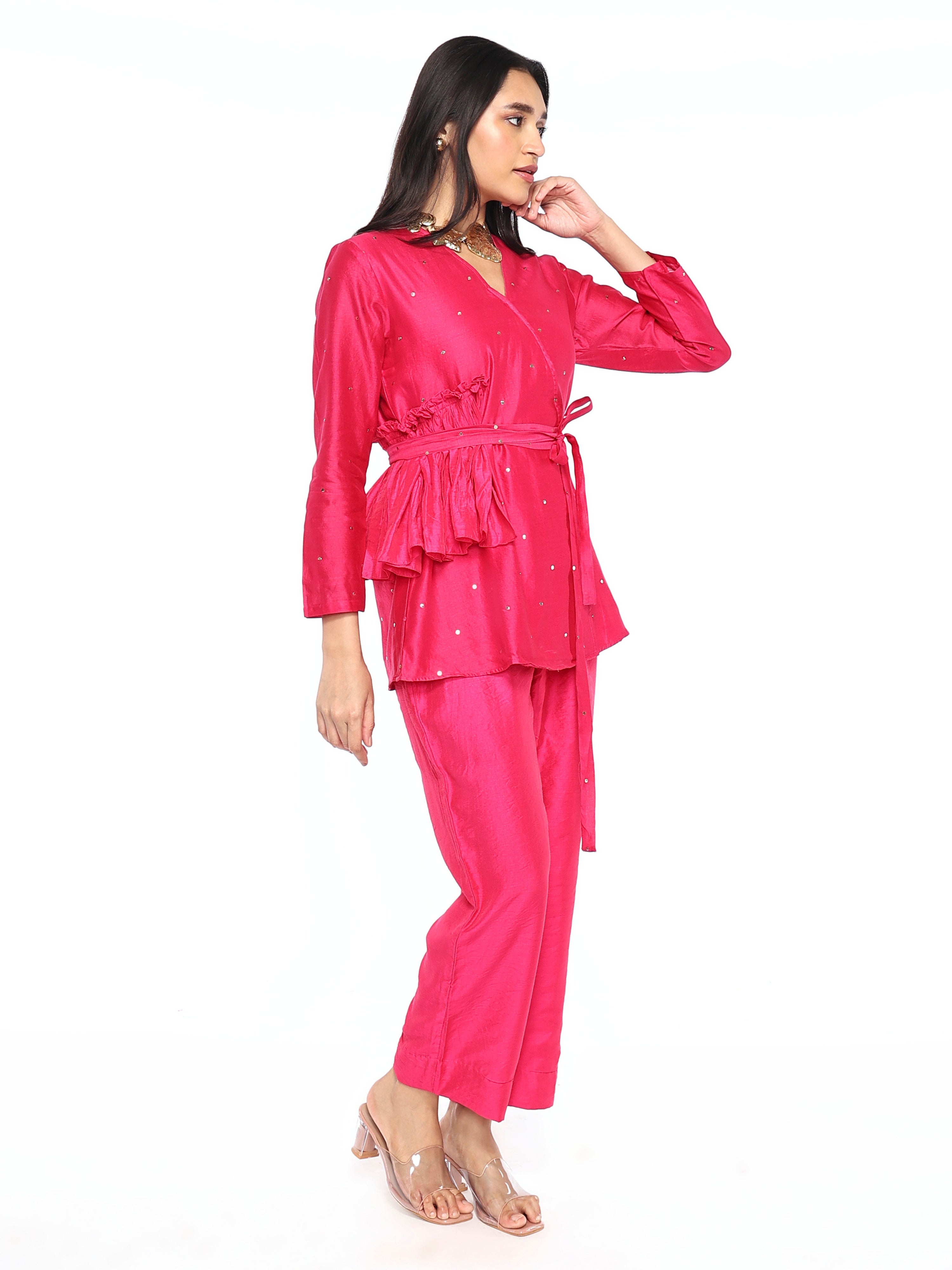 Side gathers top paired with pants and belt