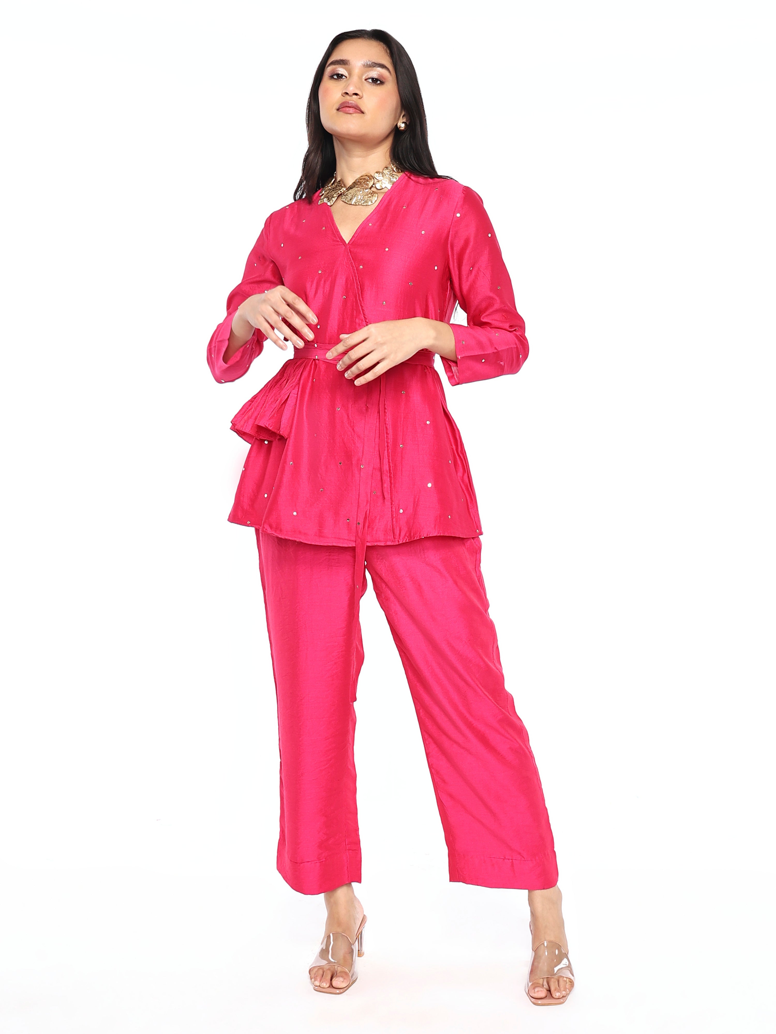 Side gathers top paired with pants and belt