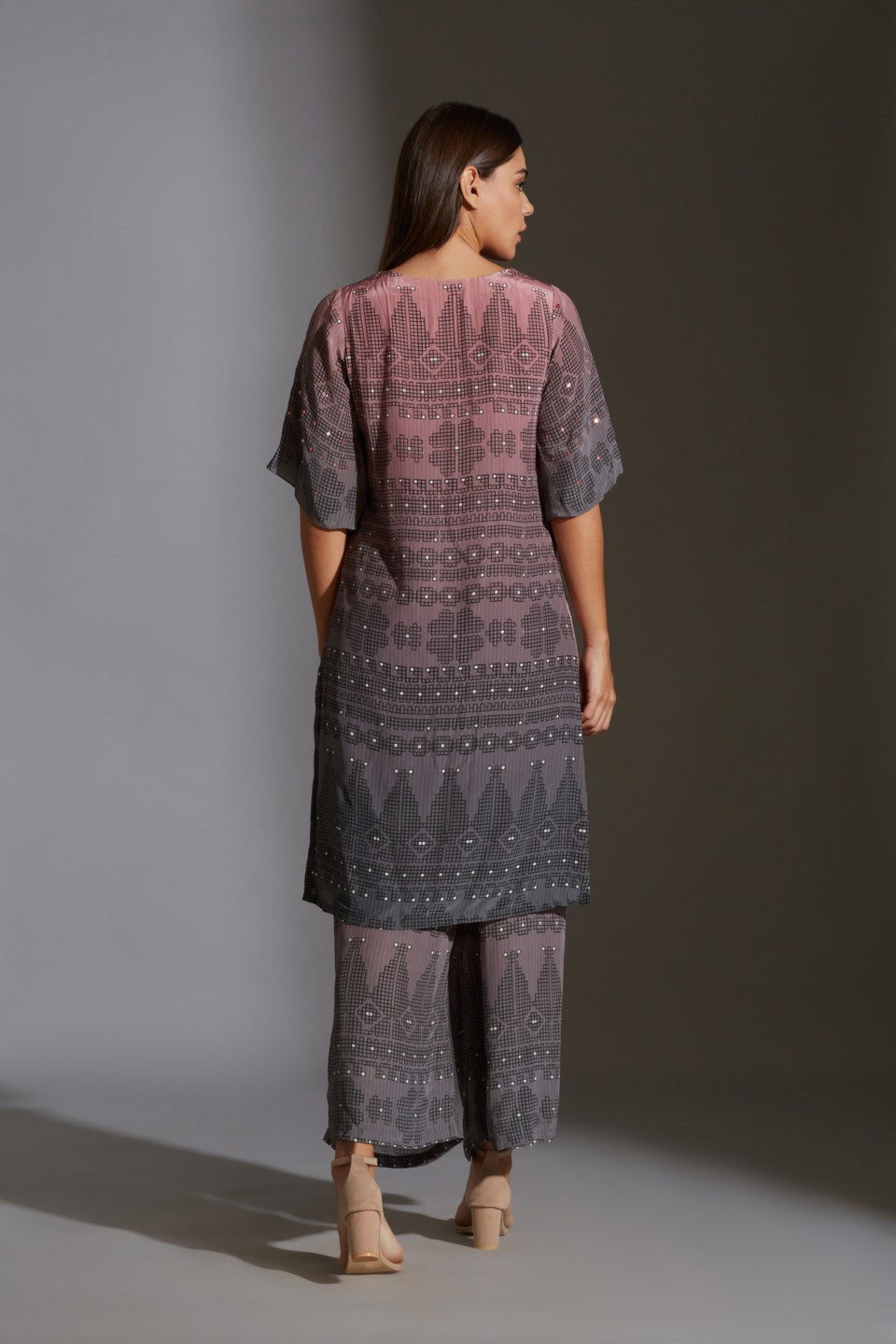 Top with bell sleeves paired with flap pants