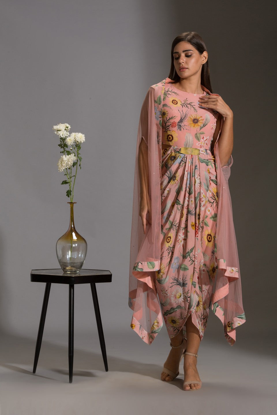 Dress with side cut paired with net cape