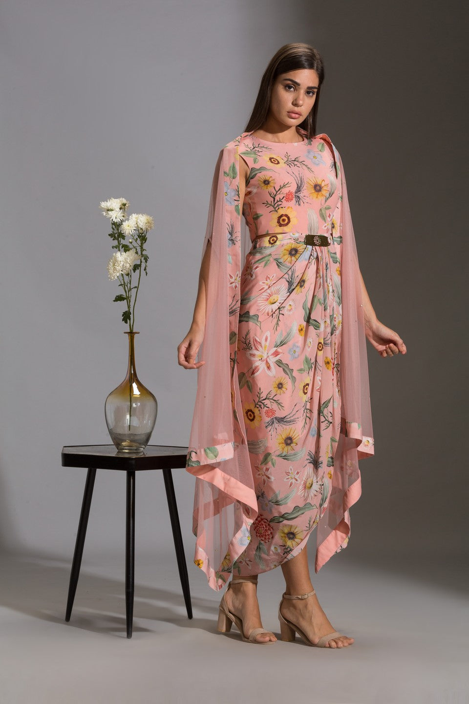 Dress with side cut paired with net cape