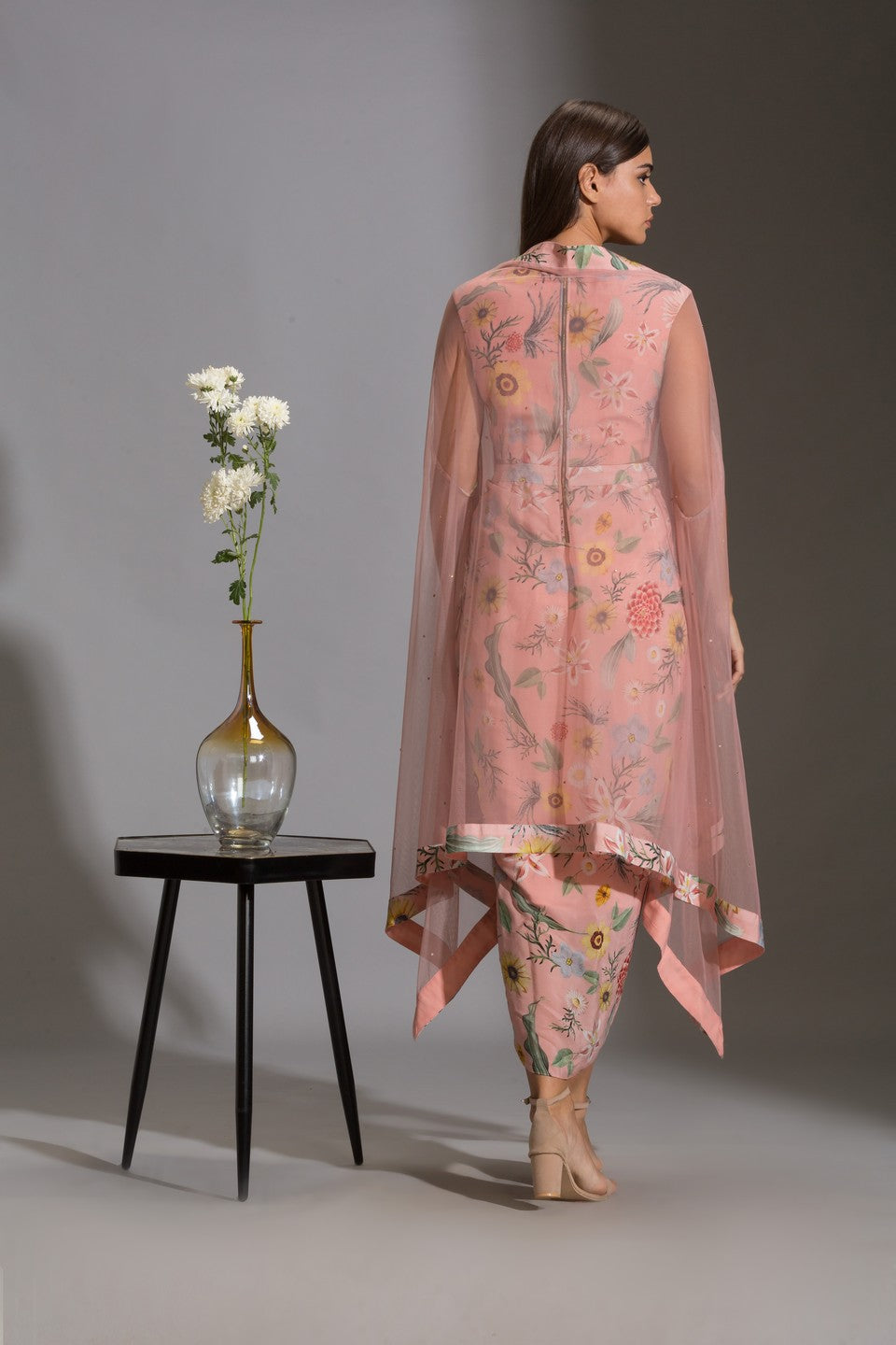 Dress with side cut paired with net cape