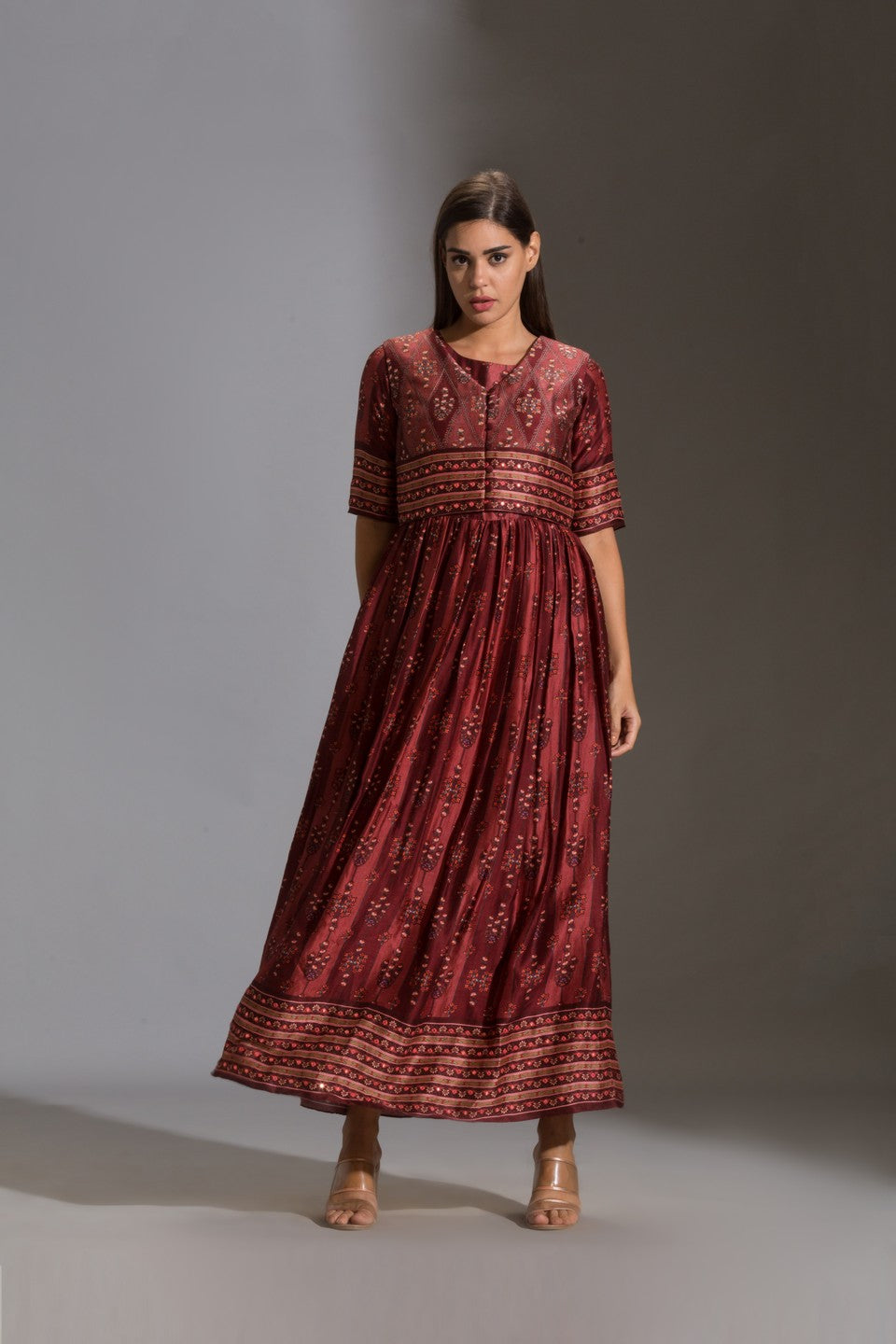 Printed dress paired with sleeveless jacket