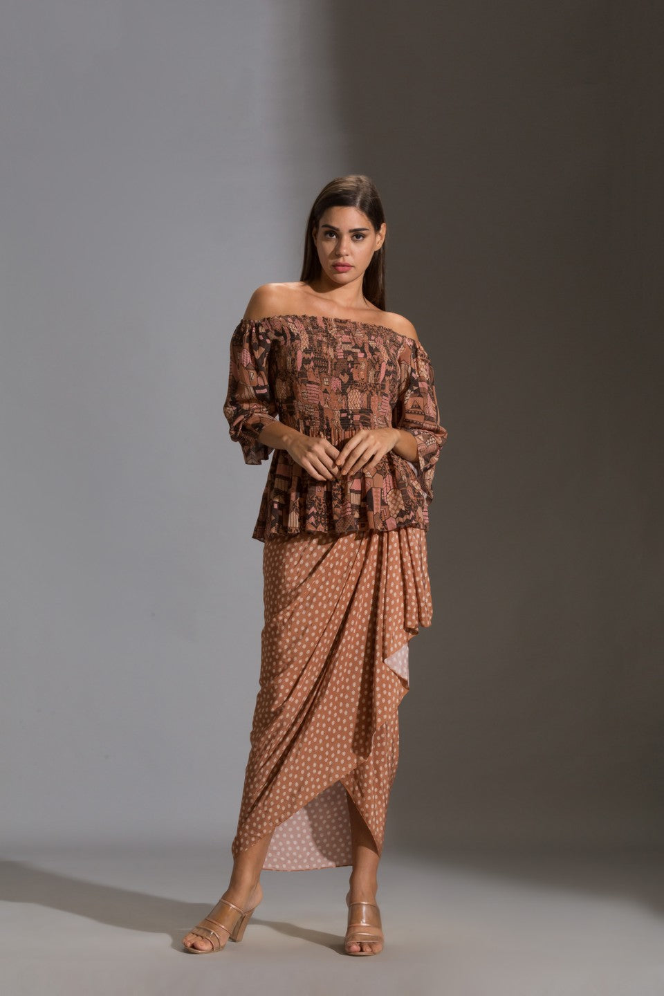 Top paired with printed dhoti skurt