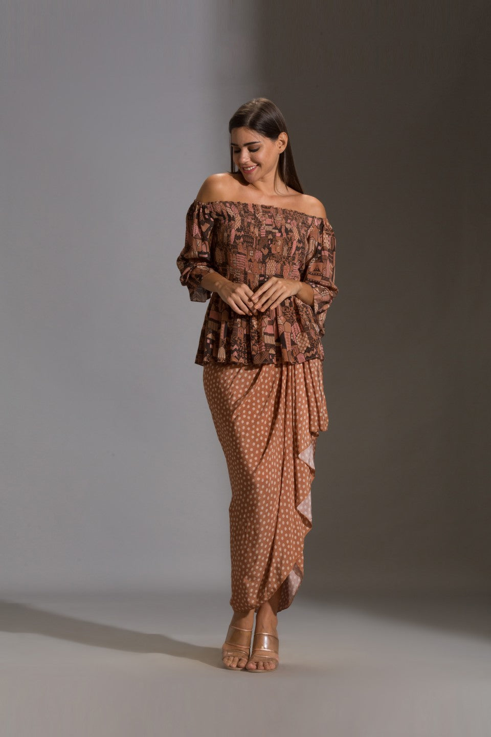 Top paired with printed dhoti skurt