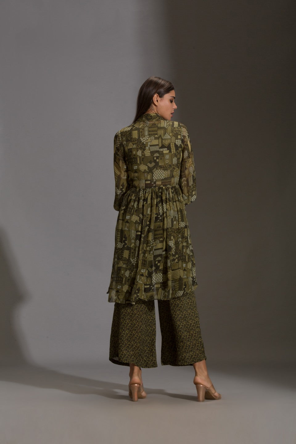 Top paired with pants and rushed jacket