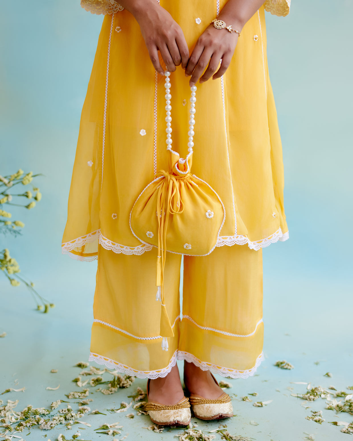 Misty Yellow Potli Bag with pearl handle and beaded tassels for women