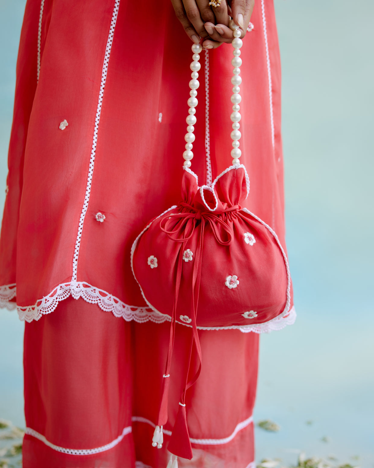 Coral Rose Potli Bag with pearl handle and beaded tassels for women