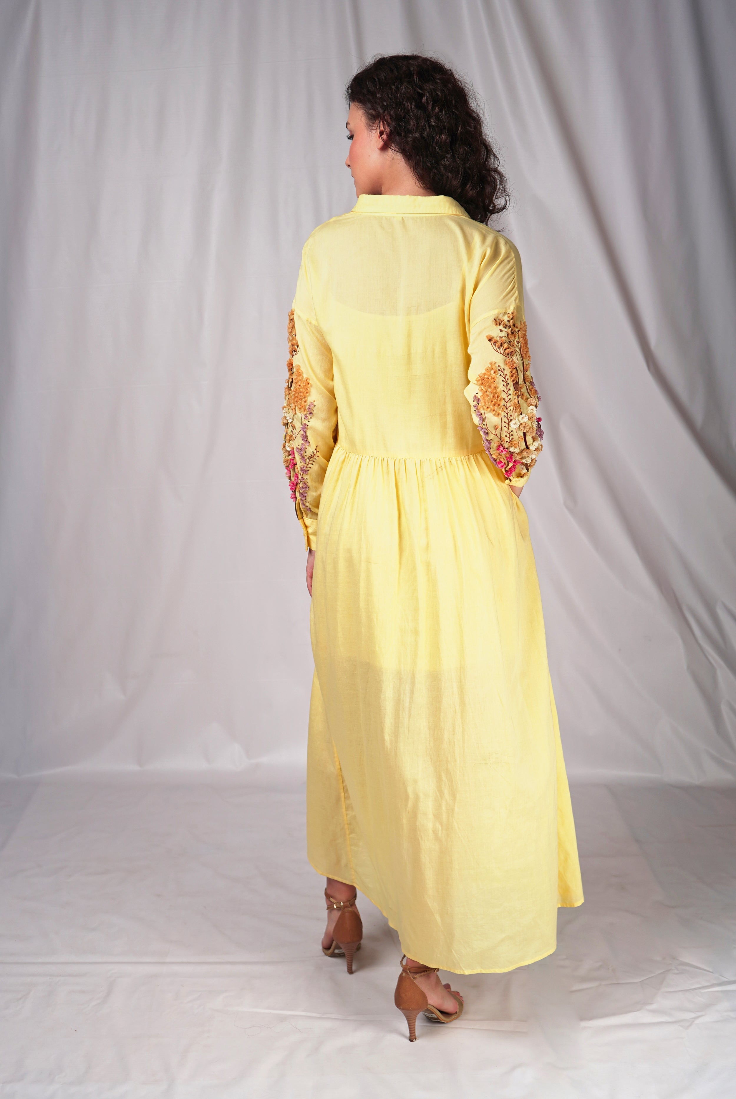 Yellow long dress with embroidery details on sleeves