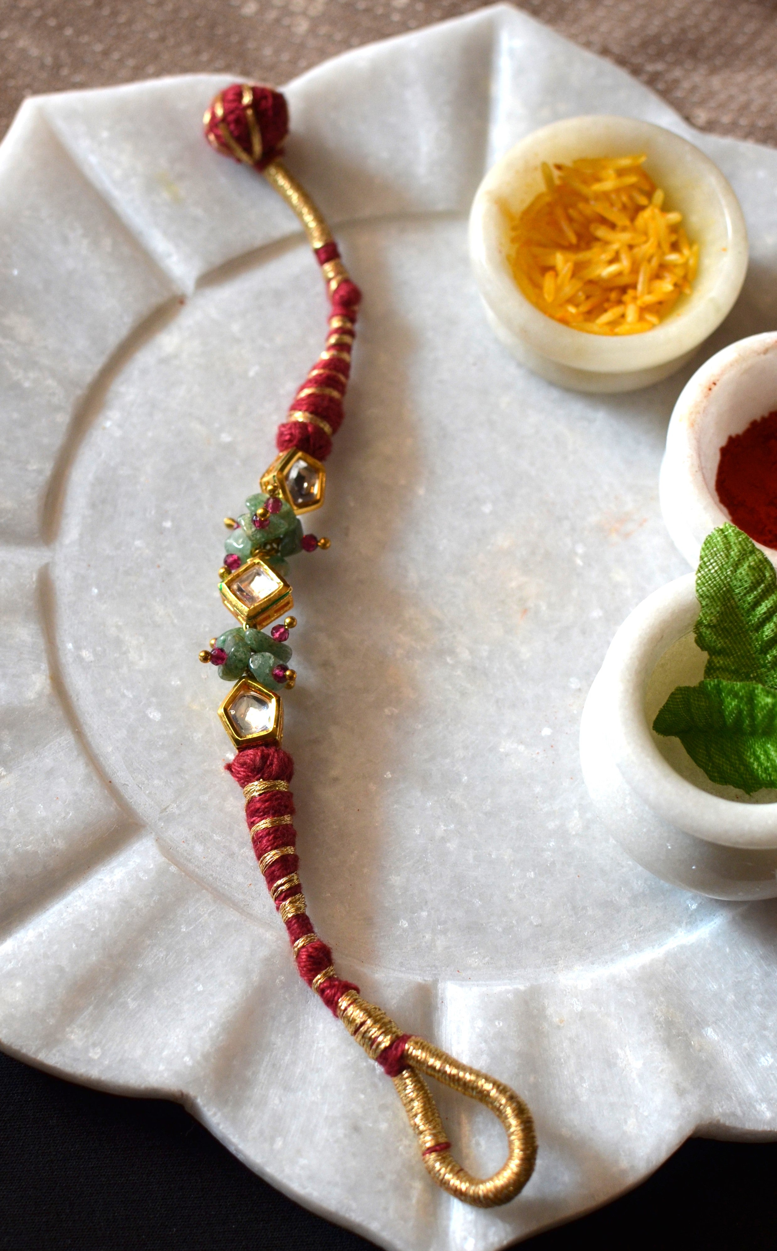 Red polki gravel rakhi bracelet