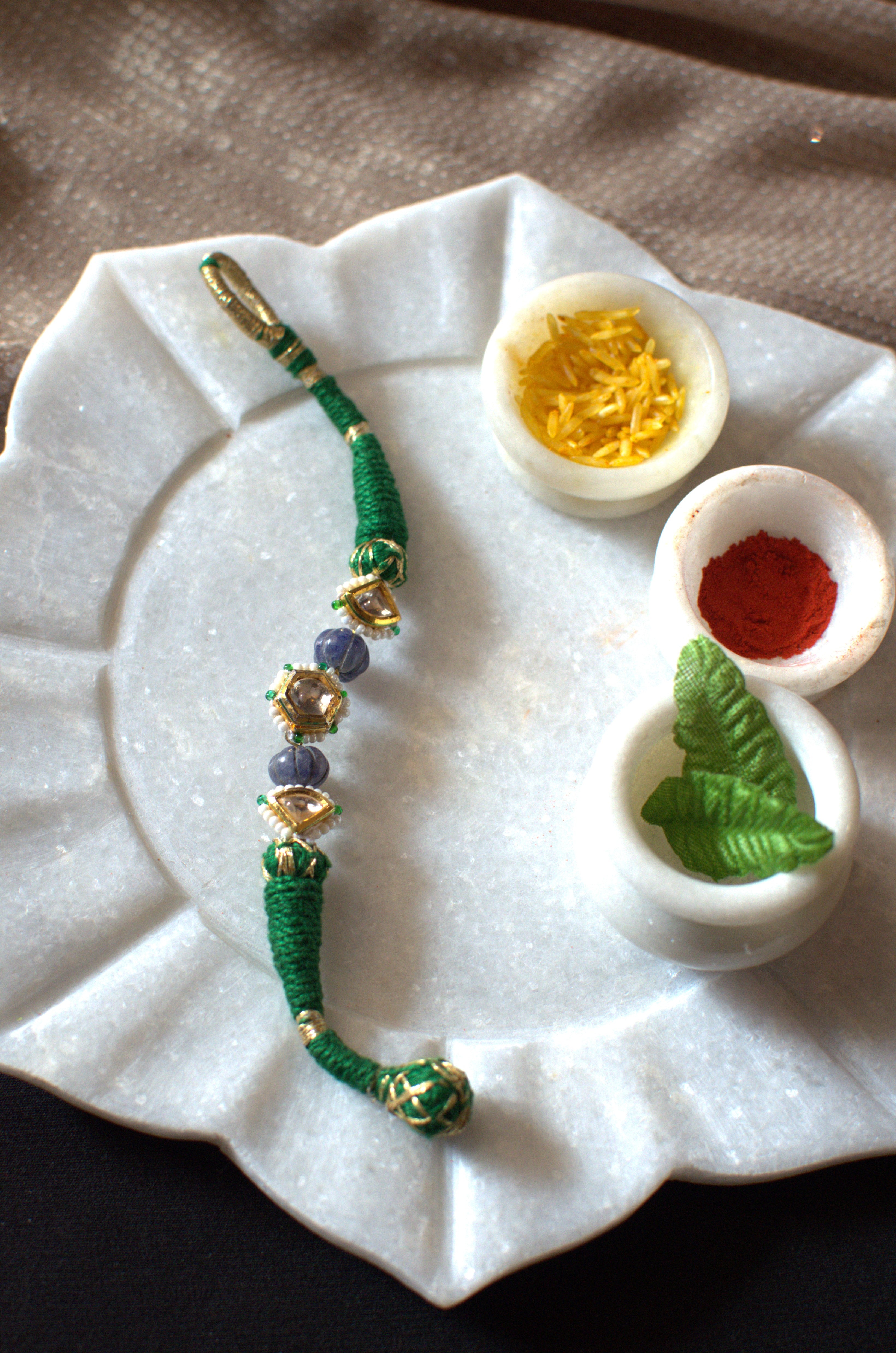 Green polki rakhi bracelet