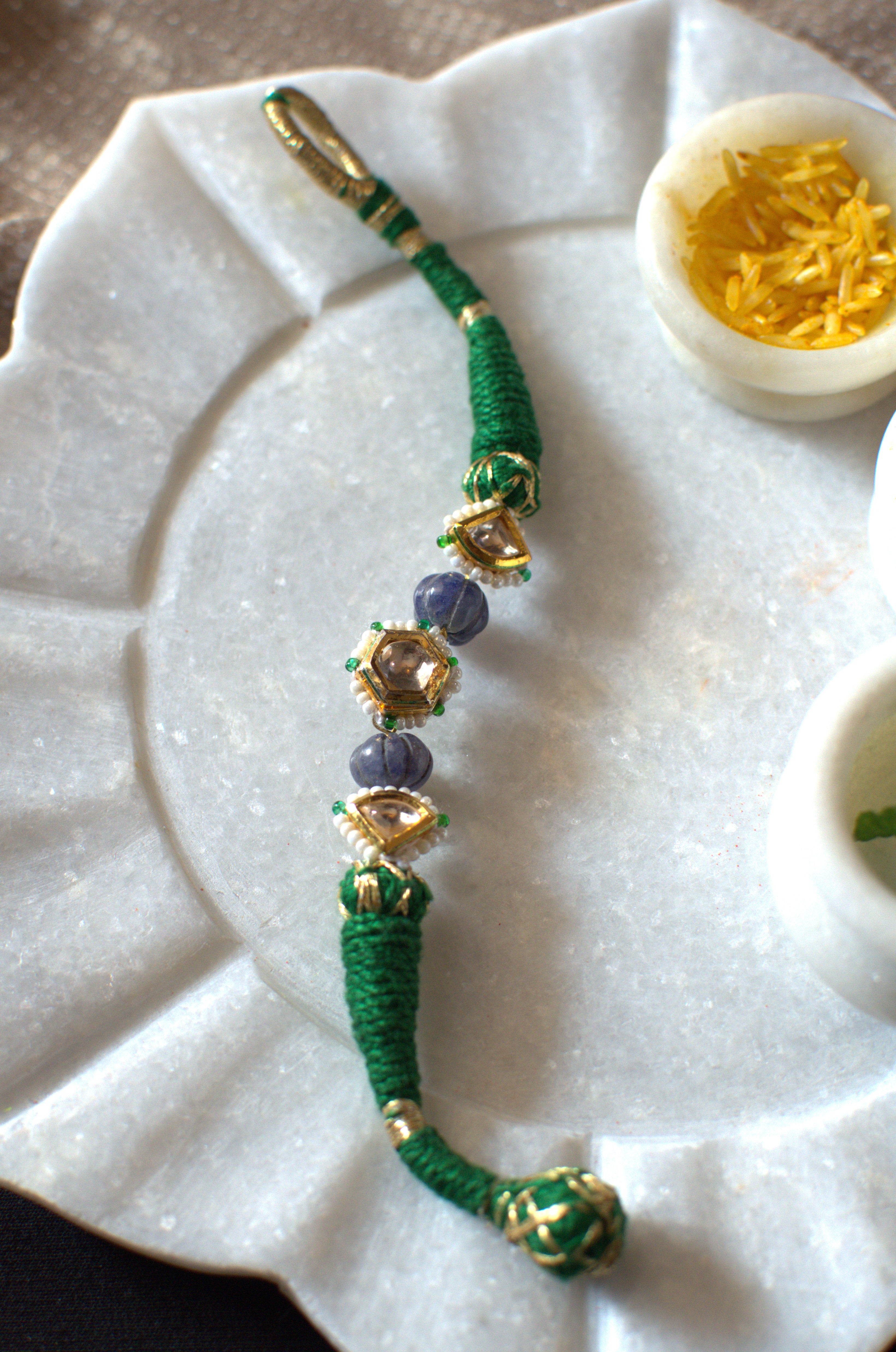 Green polki rakhi bracelet