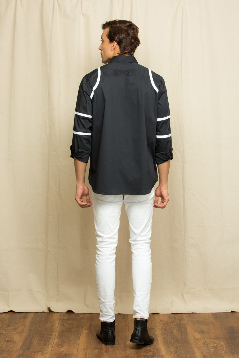 Black shirt with white stripes on shoulder / sleeves