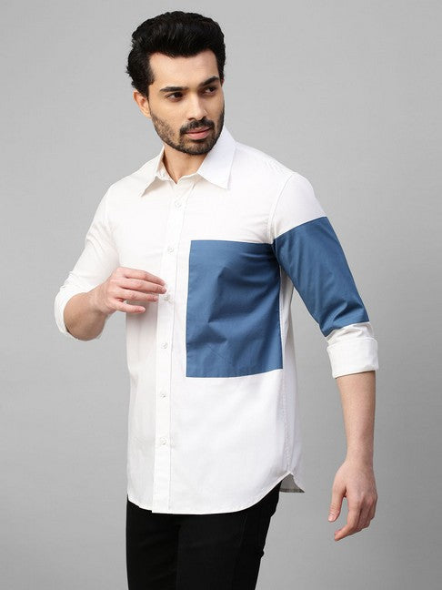 White shirt with slate blue patch on left sleeve and chest with button detailing