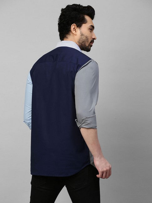 Light blue shirt with gray, dark blue and blue stripes panel on one side