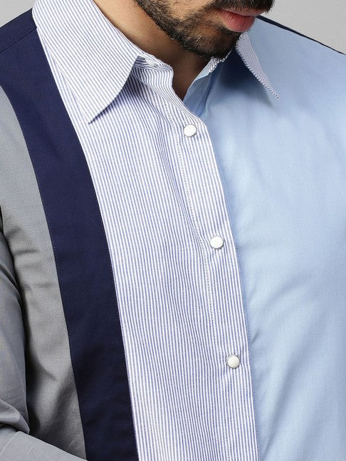 Light blue shirt with gray, dark blue and blue stripes panel on one side