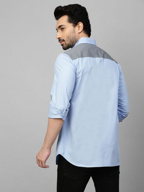 Light blue shirt with gray straps on shoulders, pocket and plaket