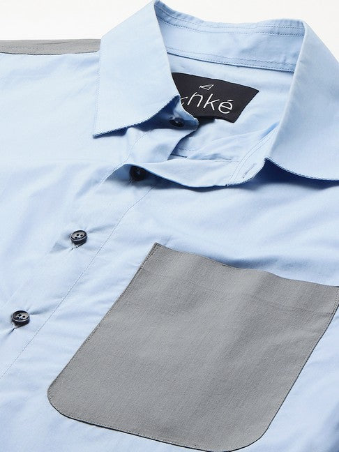 Light blue shirt with gray straps on shoulders, pocket and plaket