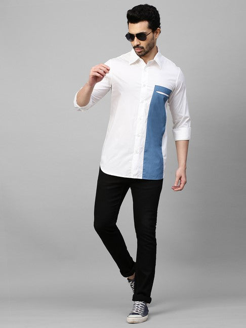 White shirt with slate blue patch on one side with slit pocket feature