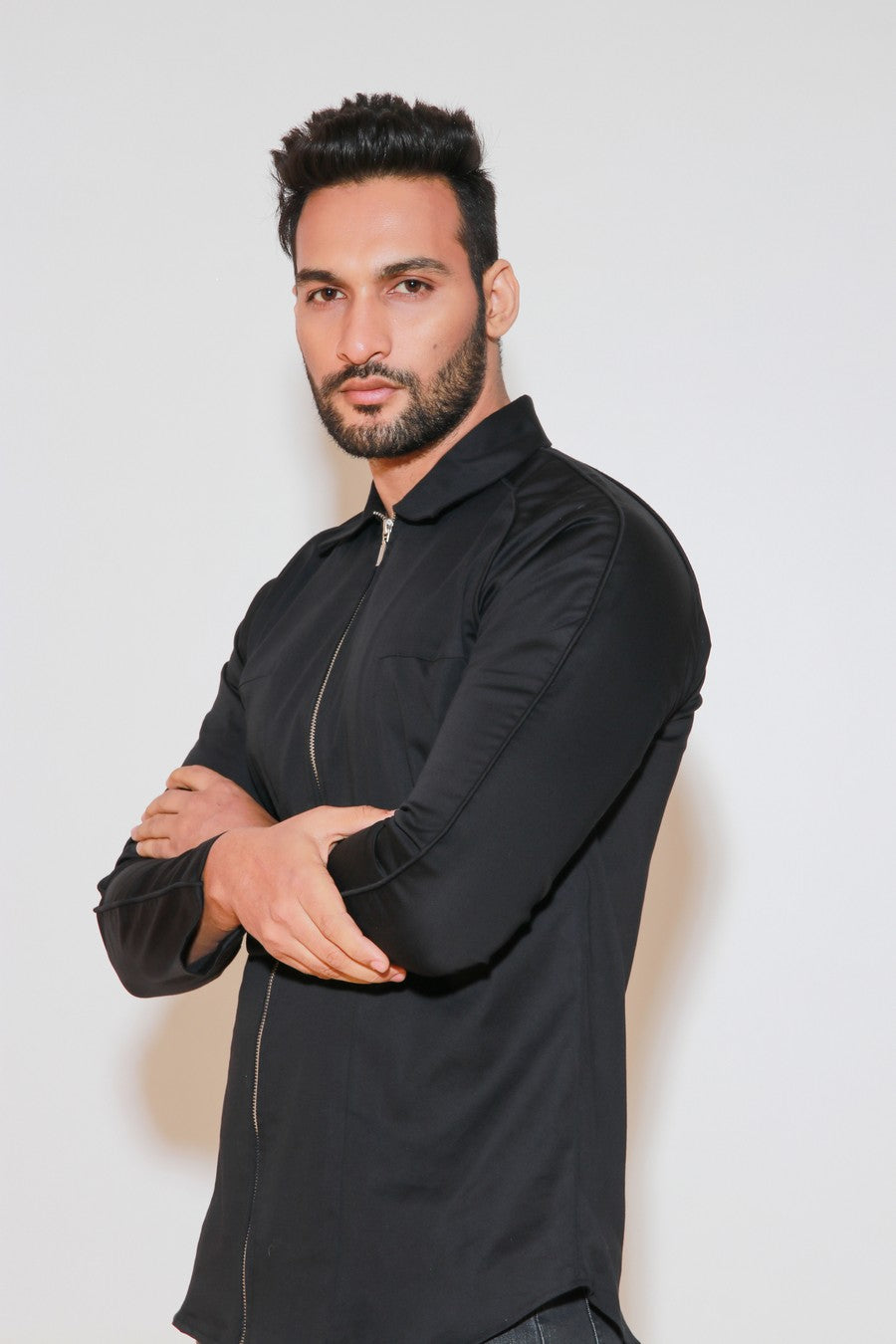 Black shirt with self piping on shoulders and zippered placket