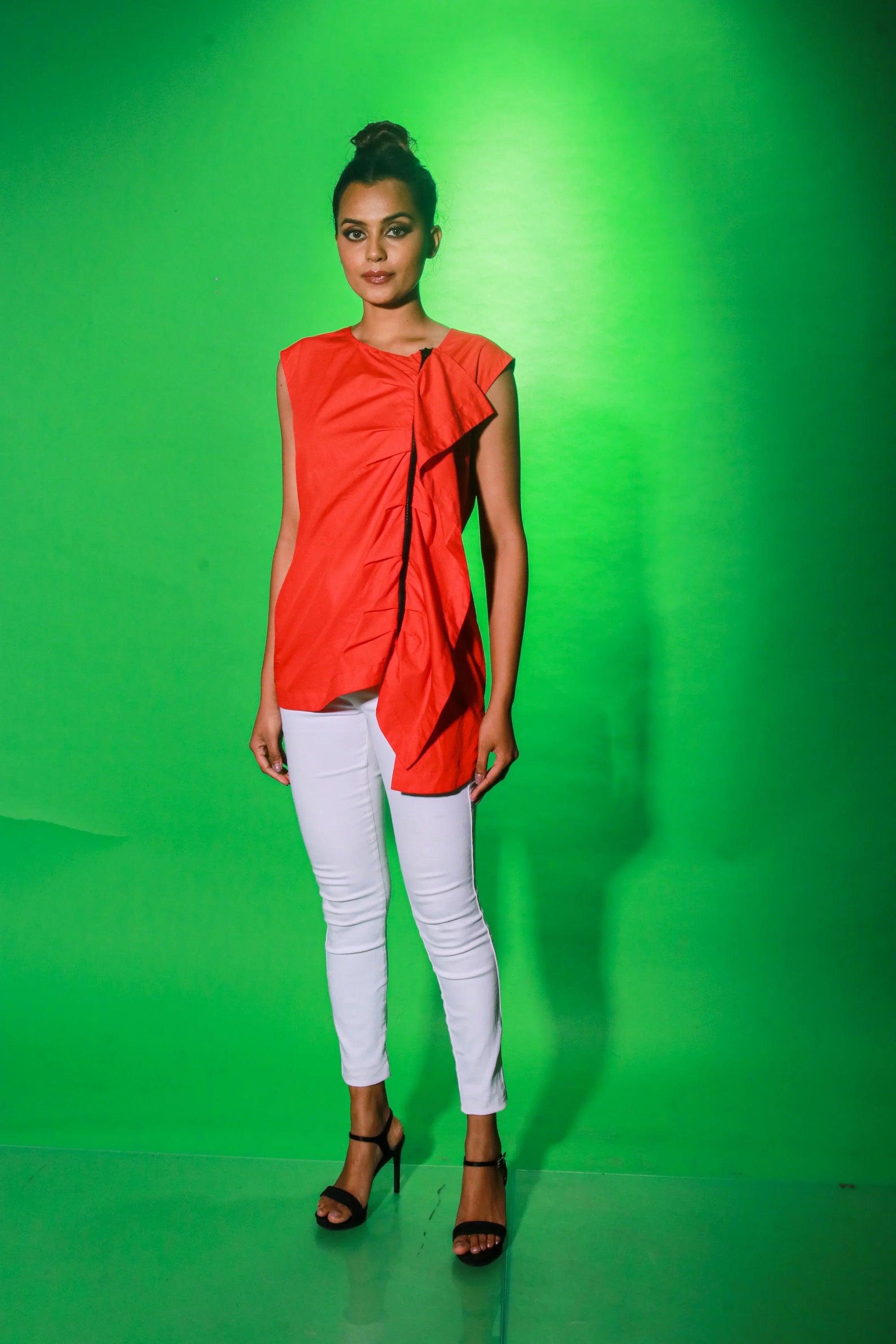 Coral sleeveless top with off center zipper placket and frill