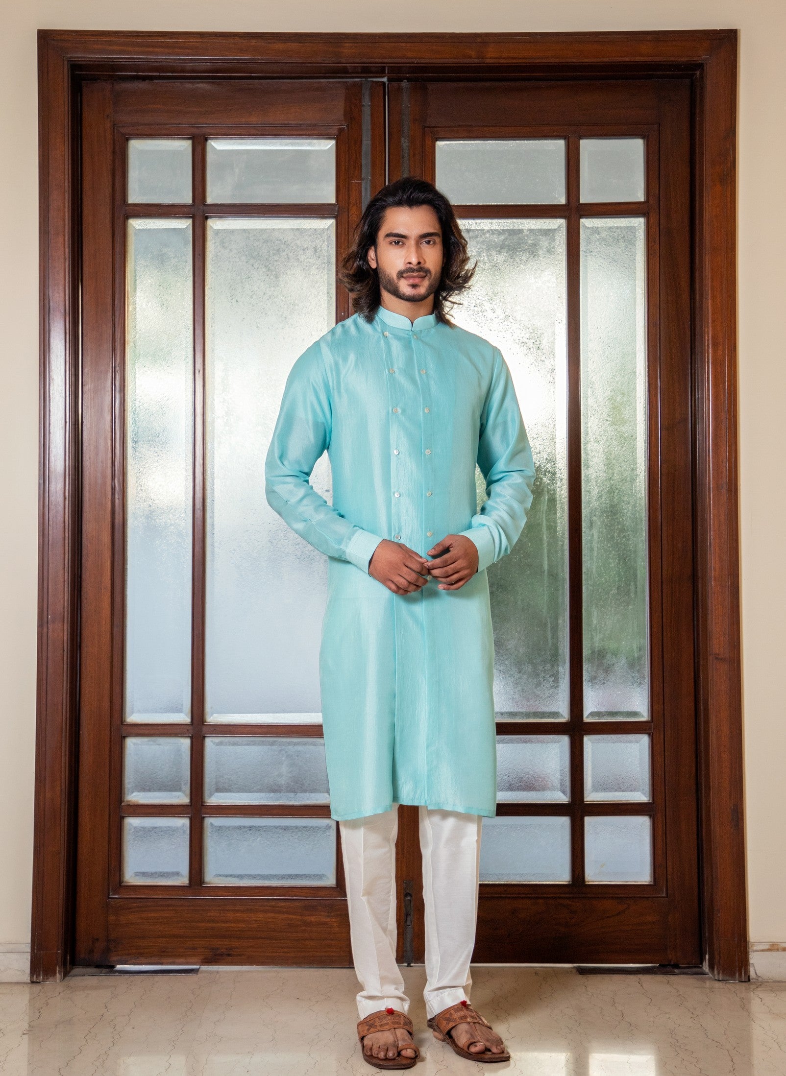 Aqua blue double breasted kurta set.