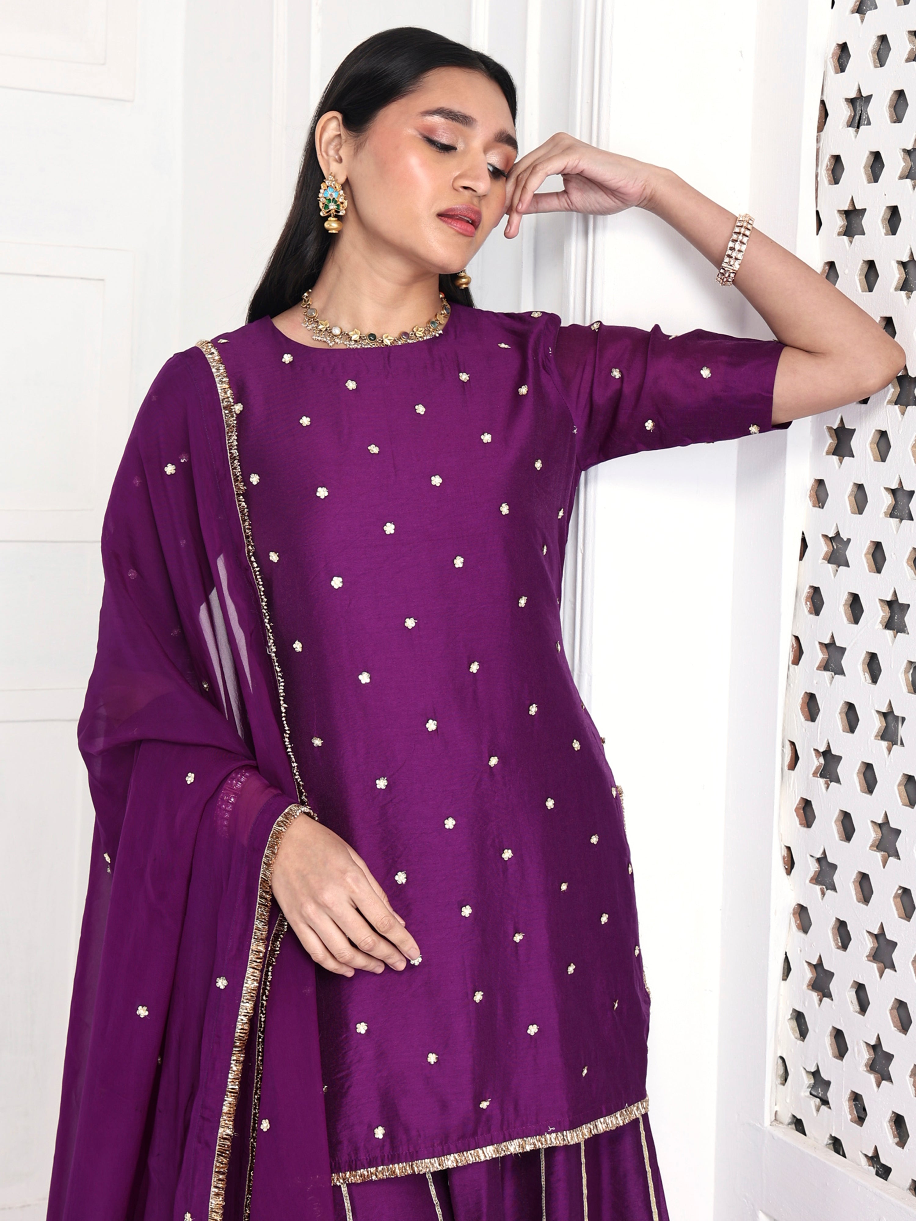 Short kurta is paired with kali palazzo and a dupatta